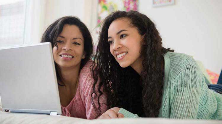 Mother and daughter applying for college scholarships together.