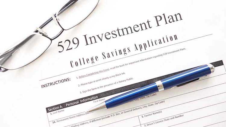 529 Plan form with eyeglasses and pen.