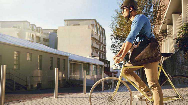 Young professional riding a bike to work.