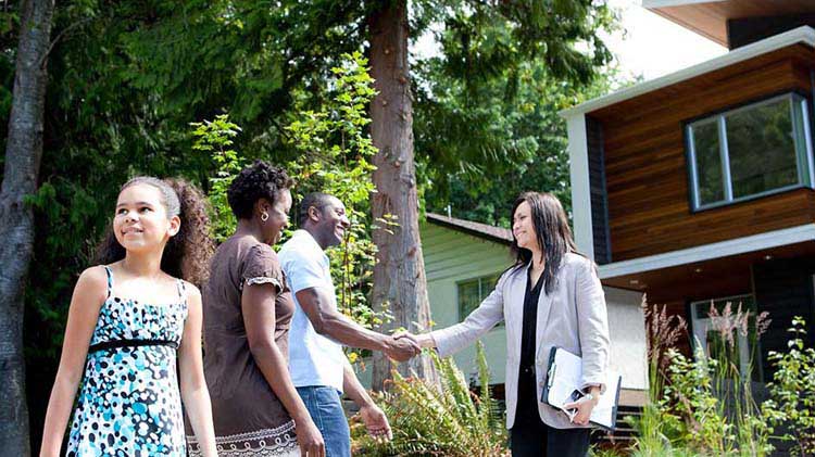 Family meeting with Realtor at a house.