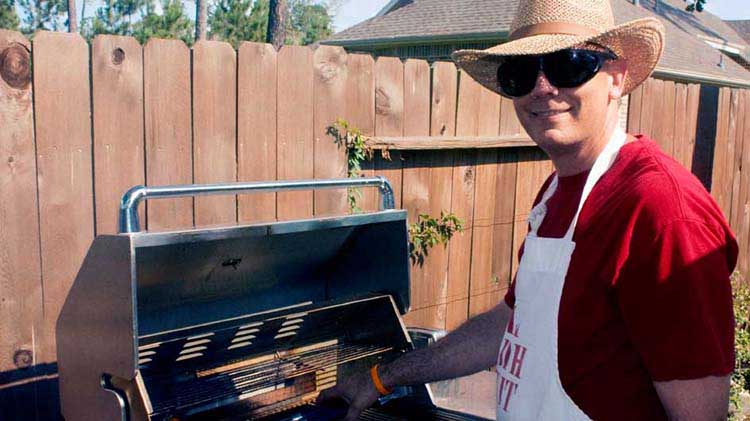 Man using grill.