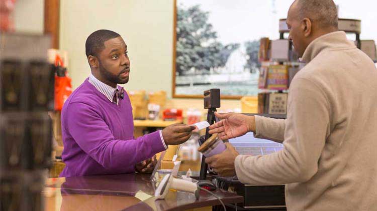 Cashier talking to a customer