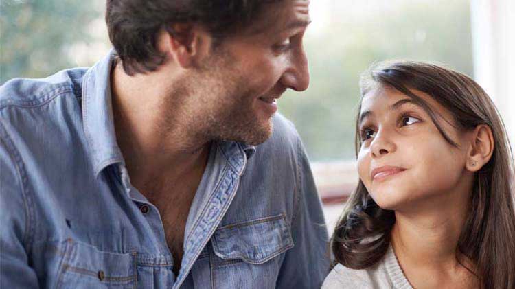 Dad talking to young daughter about emergency preparedness.