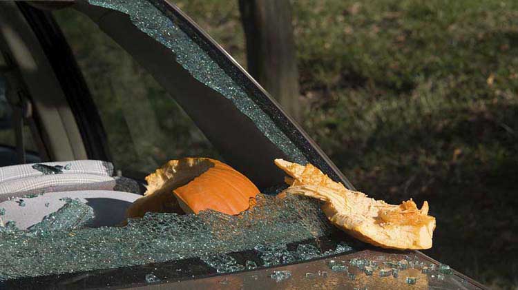 Car windshield shattered by pumpkin