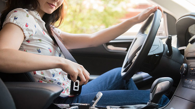 Woman checking driver assist features