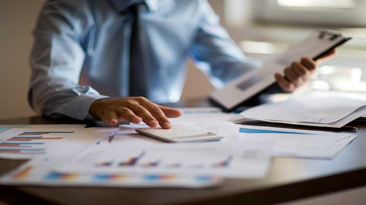 Man looking at his financial portfolio.