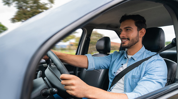 Man driving a car.