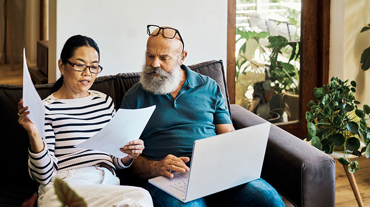 Couple looks at information about advance directives.
