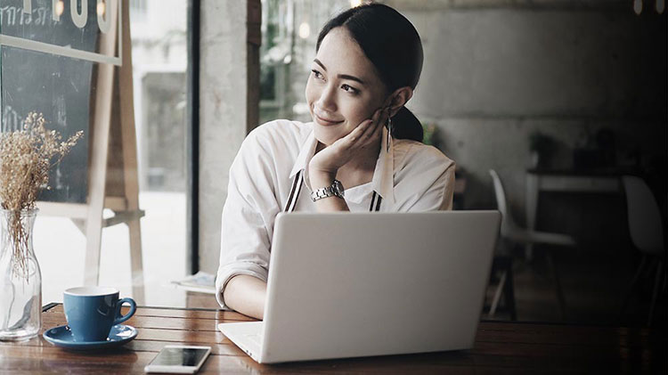 Woman sitting at laptop..