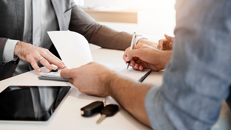 Person signing paperwork for car rental