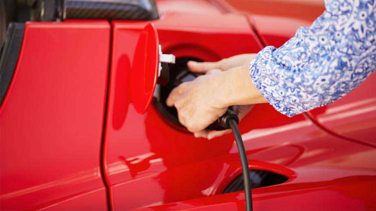 An EV at an electric vehicle charging station.