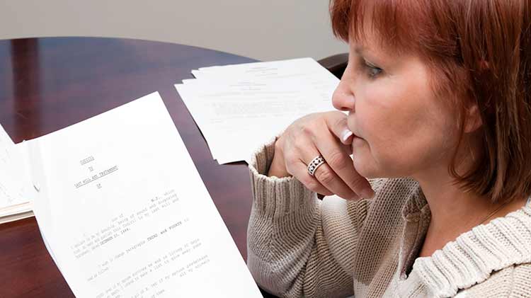 A woman is reviewing her will.