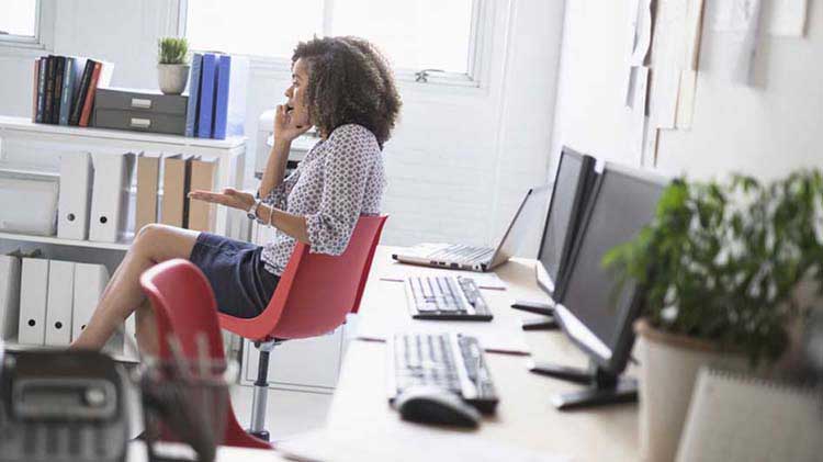 Woman on the phone discussing her identity theft report.