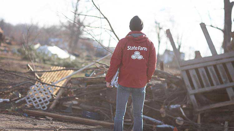 State Farm agent viewing damage after a tornado.