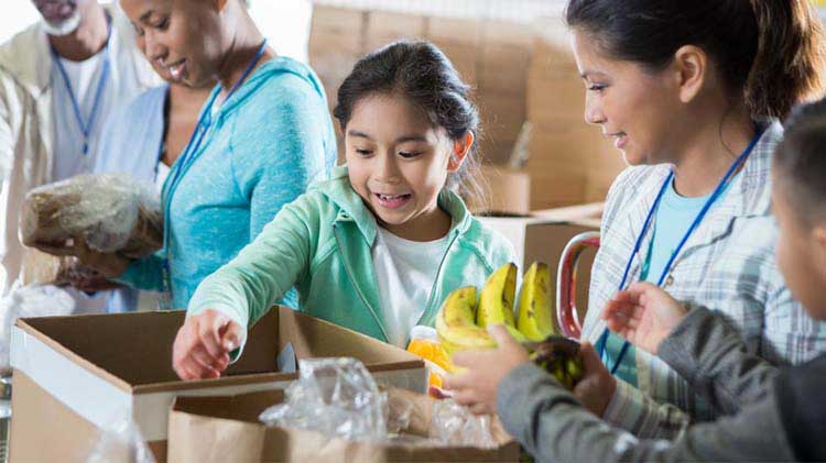 A family volunteering at a food pantry organization.