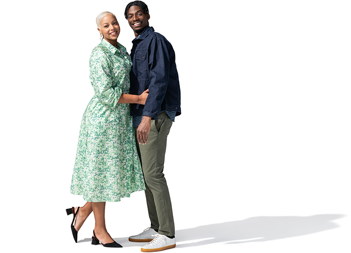 Women embrasing a man for a picture. 