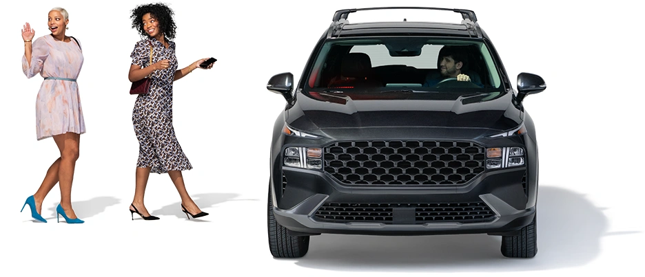 A pair of ladies head toward their driver, who’s waiting in an black SUV.