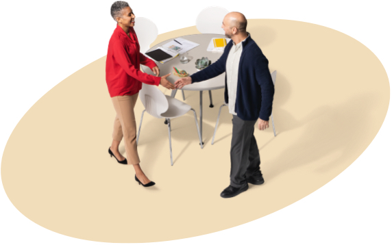 A female State Farm agent greets a gentleman in a black jacket.