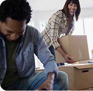 Couple unpacking boxes