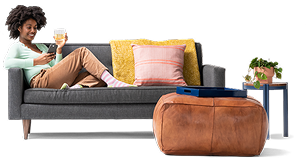 customer on couch with laptop