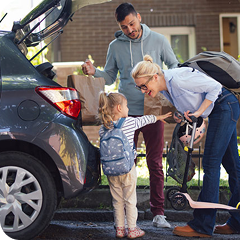 Family packing things in the car