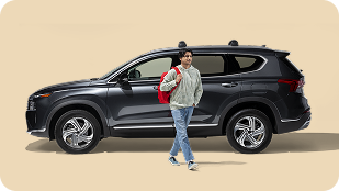 State Farm agent with customer in front of car